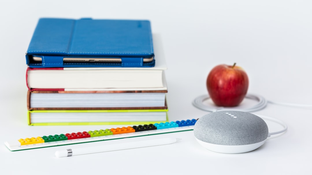 We produced this image in the Digitized House studio as a featured image for an editorial piece entitled “5 approaches to make digital assistants a partner in your kids’ education.” We wanted to give a flavor of digital assistant-aided schoolwork, so what better way than to use a stack of school books, an iPad Pro in a saturated blue Snugg case, an Apple Pencil, a multicolored Lego ruler, a Google Home Mini processing a command, and a red apple encircled by the Google Home power cord. We lit the composition with a large softbox powered by a Godox AD200 flash. Focal plane in foreground.